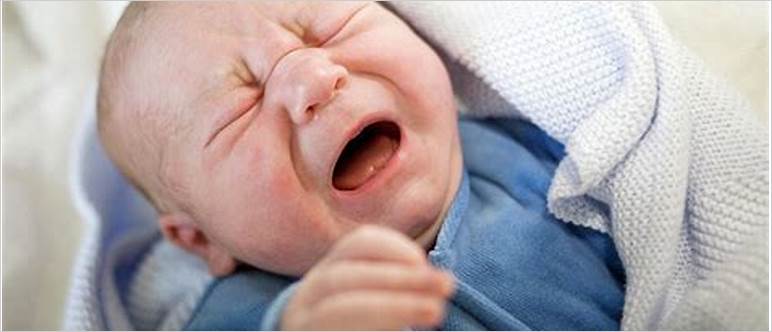 Newborn crying at breast